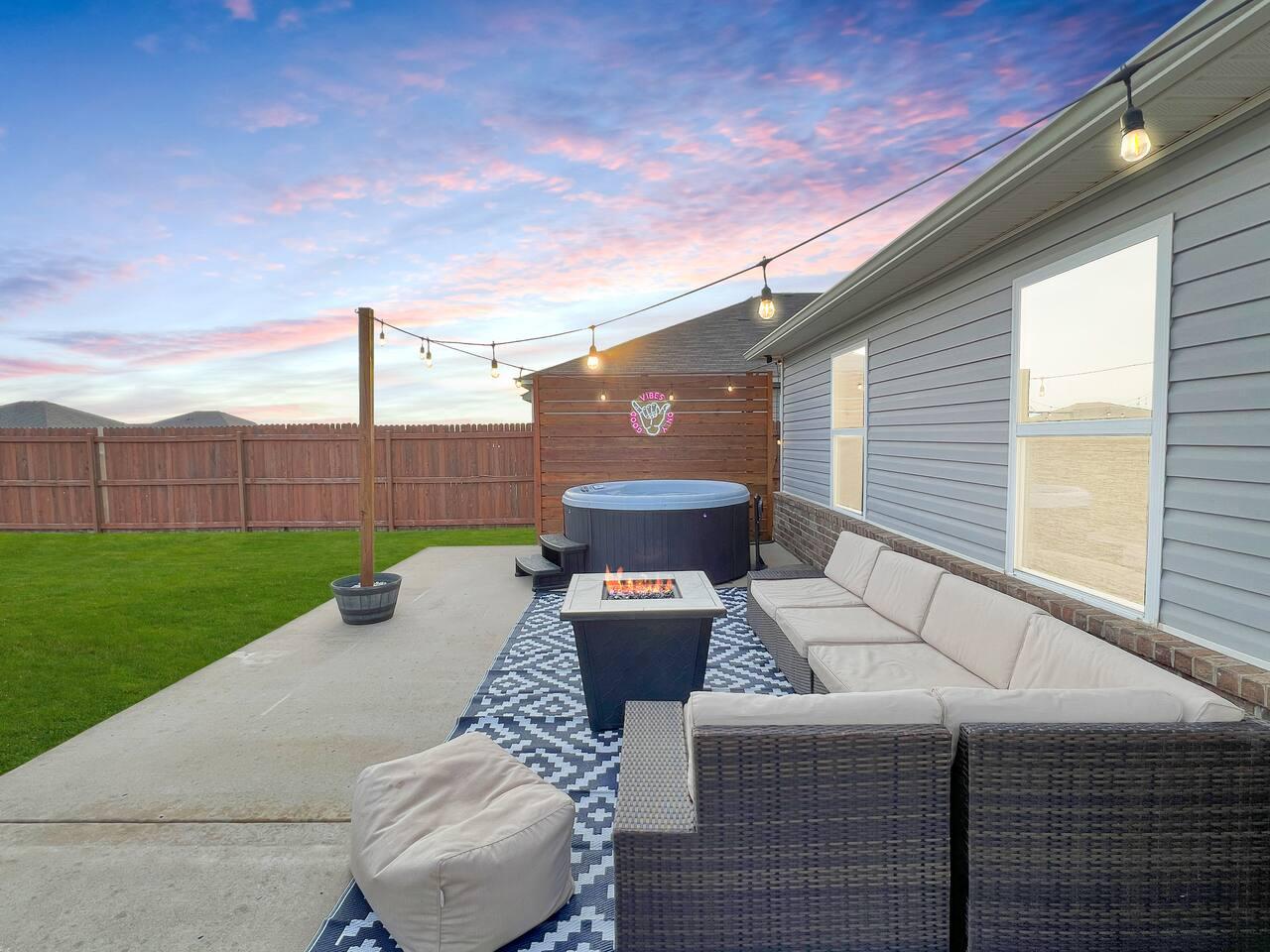 Back patio - Large outdoor space with Classic Nordic Spa that seats up to 6 adults. 
Stainless steel propane grill for grilling.
Fire pit table and outdoor sectional.
