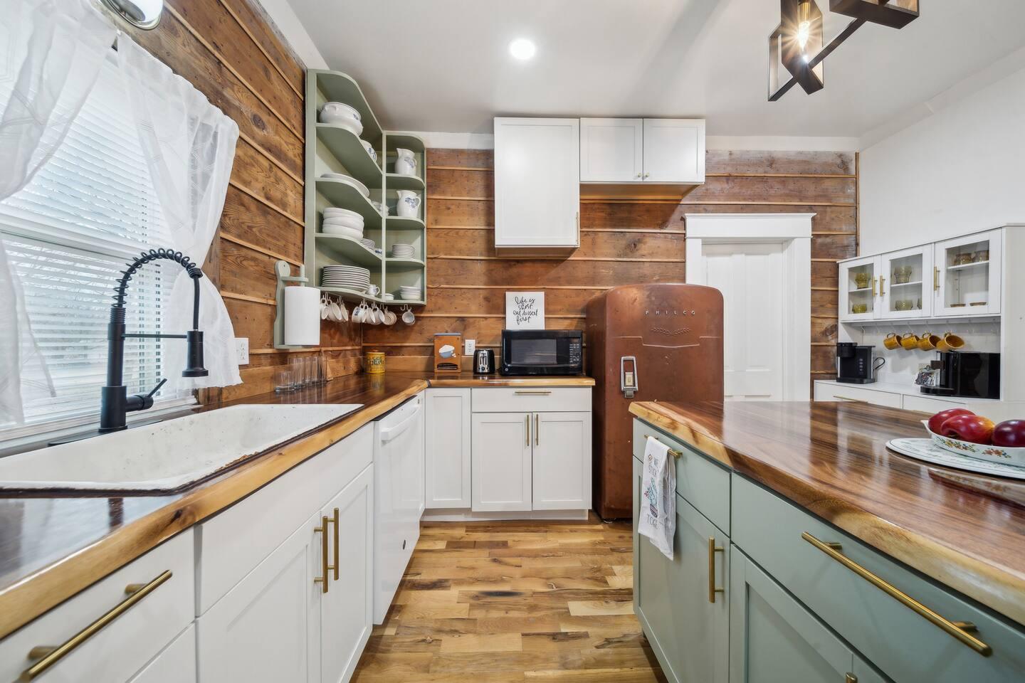 Kitchen - Farmhouse sink, custom wood countertops, and all the essentials for cooking.