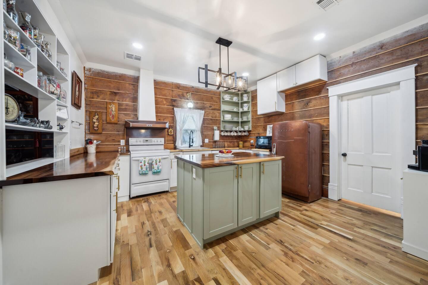 Kitchen - Fully stocked with open shelving, a coffee bar, and all the essentials for home-cooked meals.