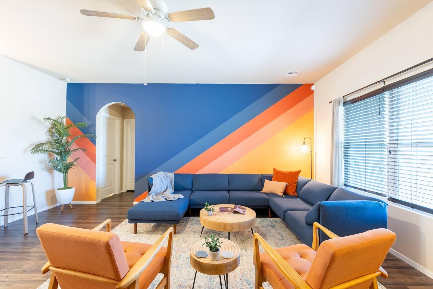 Living room - Large wrap around sectional with a 65 inch TV.