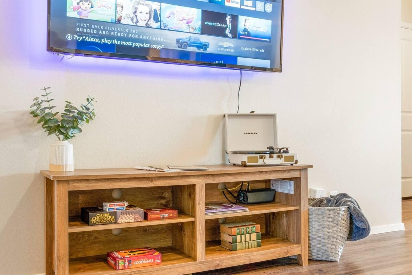 Entertainment Center: 65" LED 4K Smart Fire TV - Vinyl record player - Board games - Playing Cards