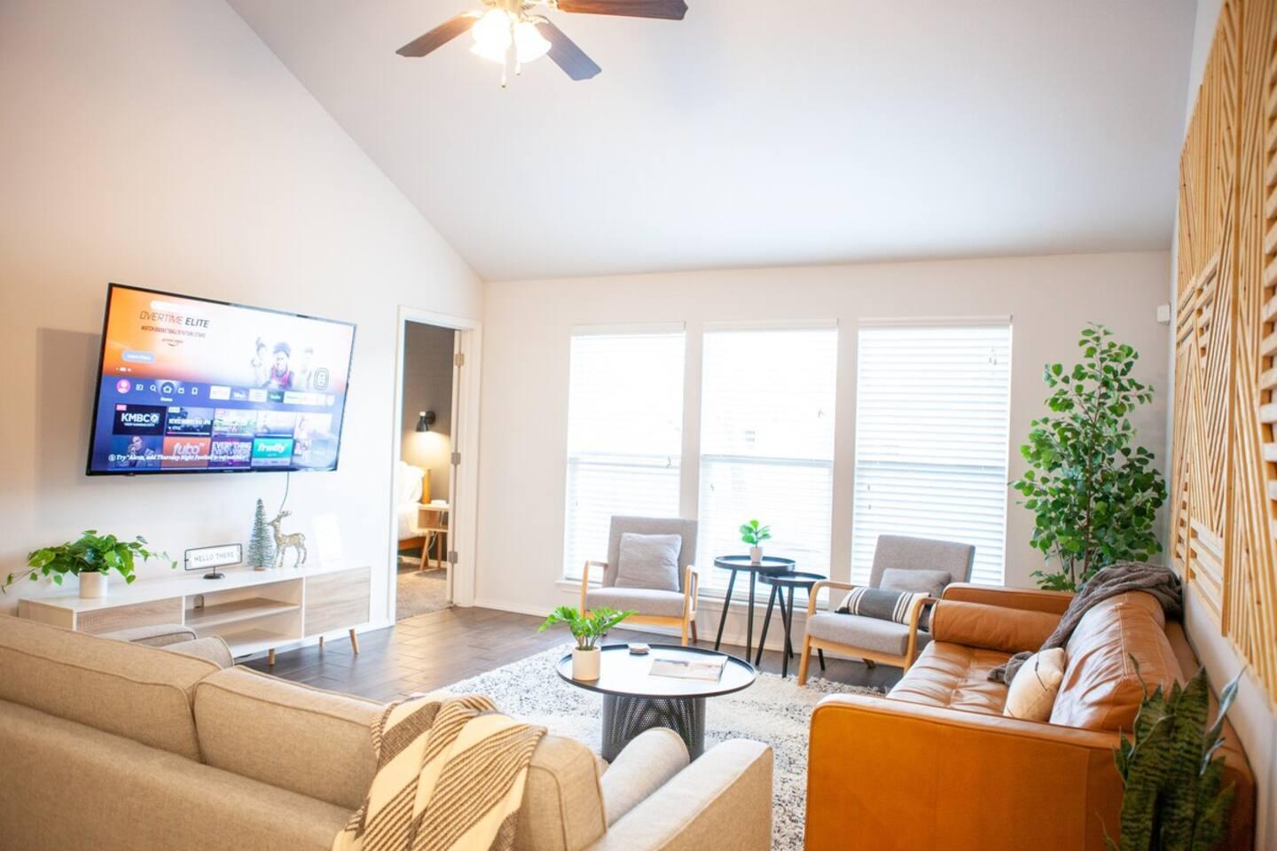 Living room - 65 Inch 4K Smart TV. Free subscriptions to Netflix, Disney +, Hulu, and Amazon Prime.
