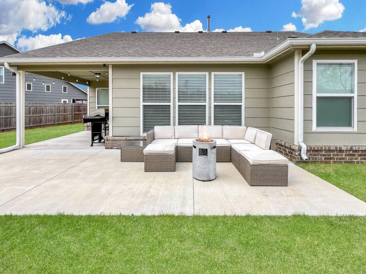 Back patio - Wrap around outdoor sectional with gas fire pit.
Stainless steel propane grill.