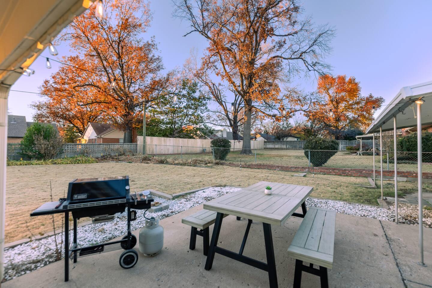 Back patio - Outdoor dining table & propane grill are great for grilling your favorite foods and enjoying the large backyard.