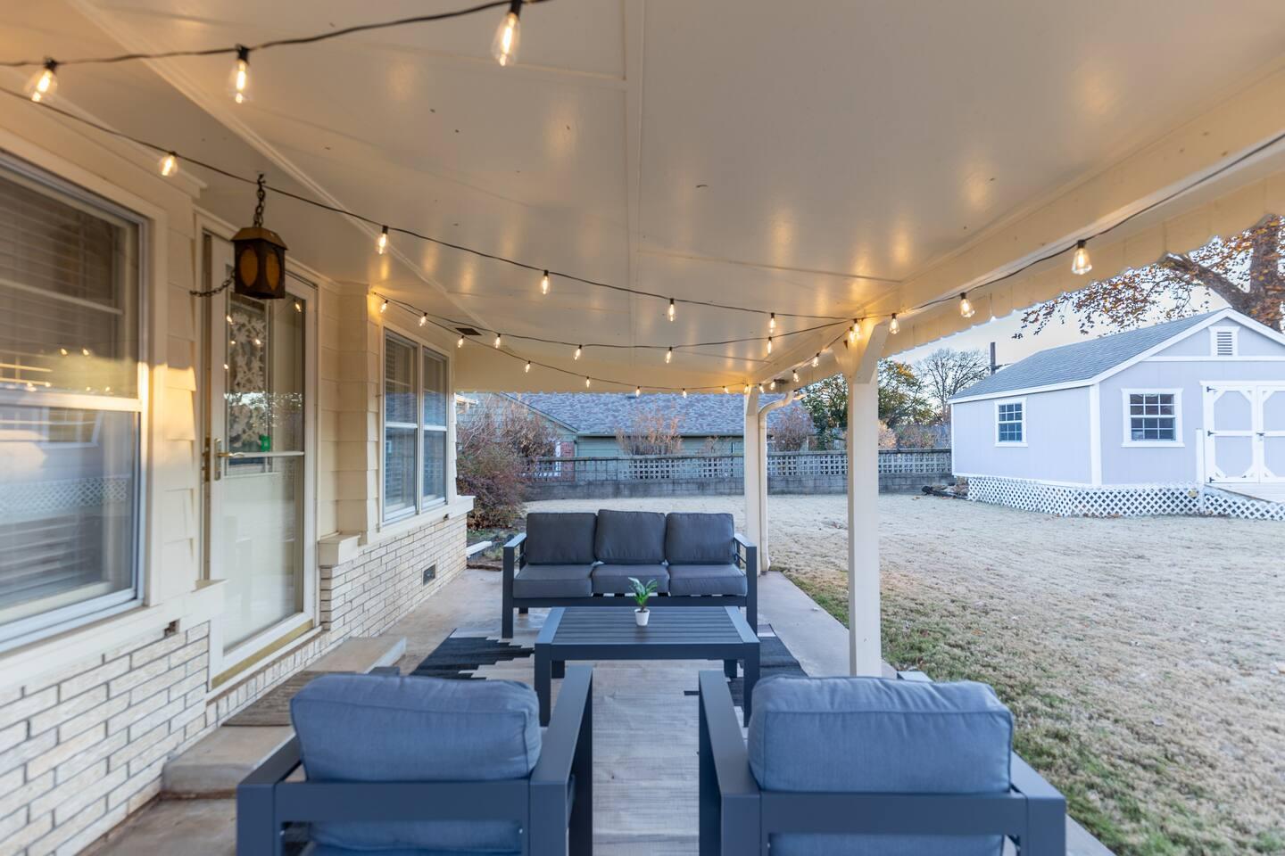 Back patio - Large patio space with outdoor sofas and chairs under a covered patio.