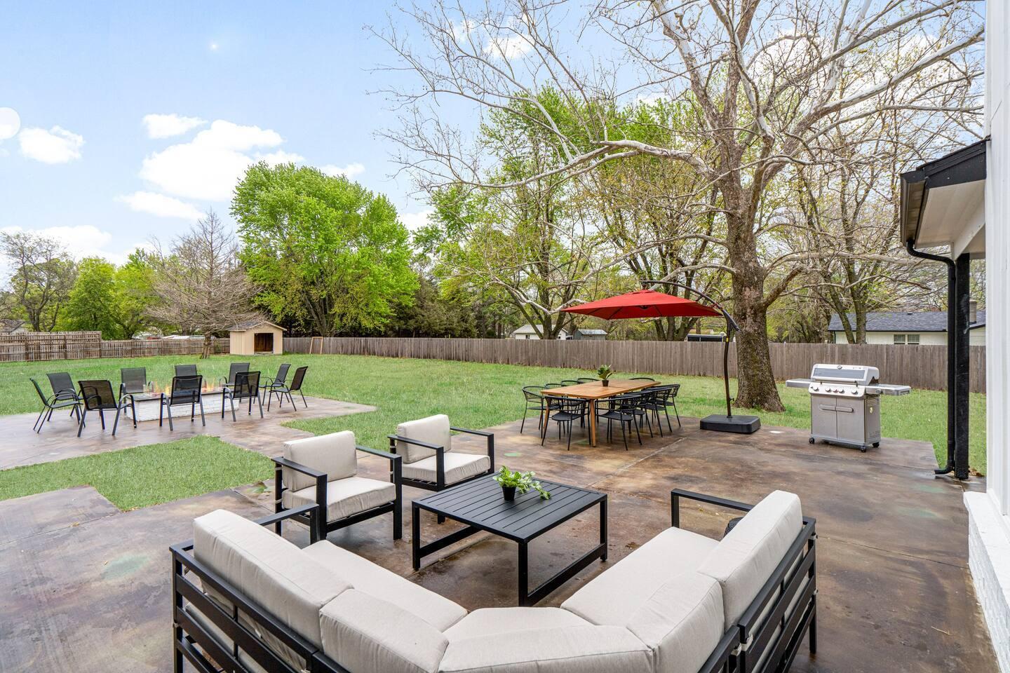 Back patio - Plenty of space to lounge, enjoy a meal or sit around the fire.
